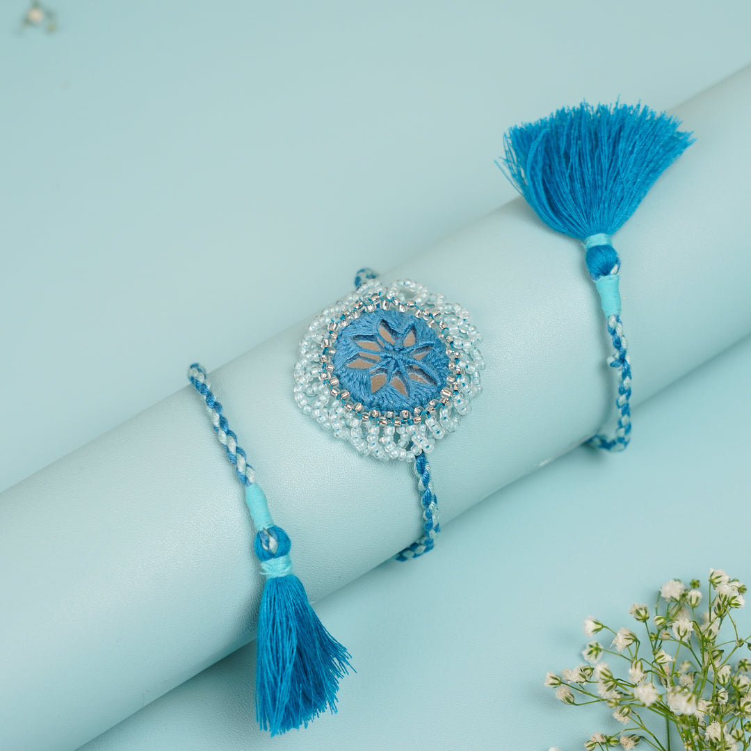 Handmade Reusable Blue Mirror And Jhumki Rakhi For Brother - Bracelet Displayed on Rolled Stand