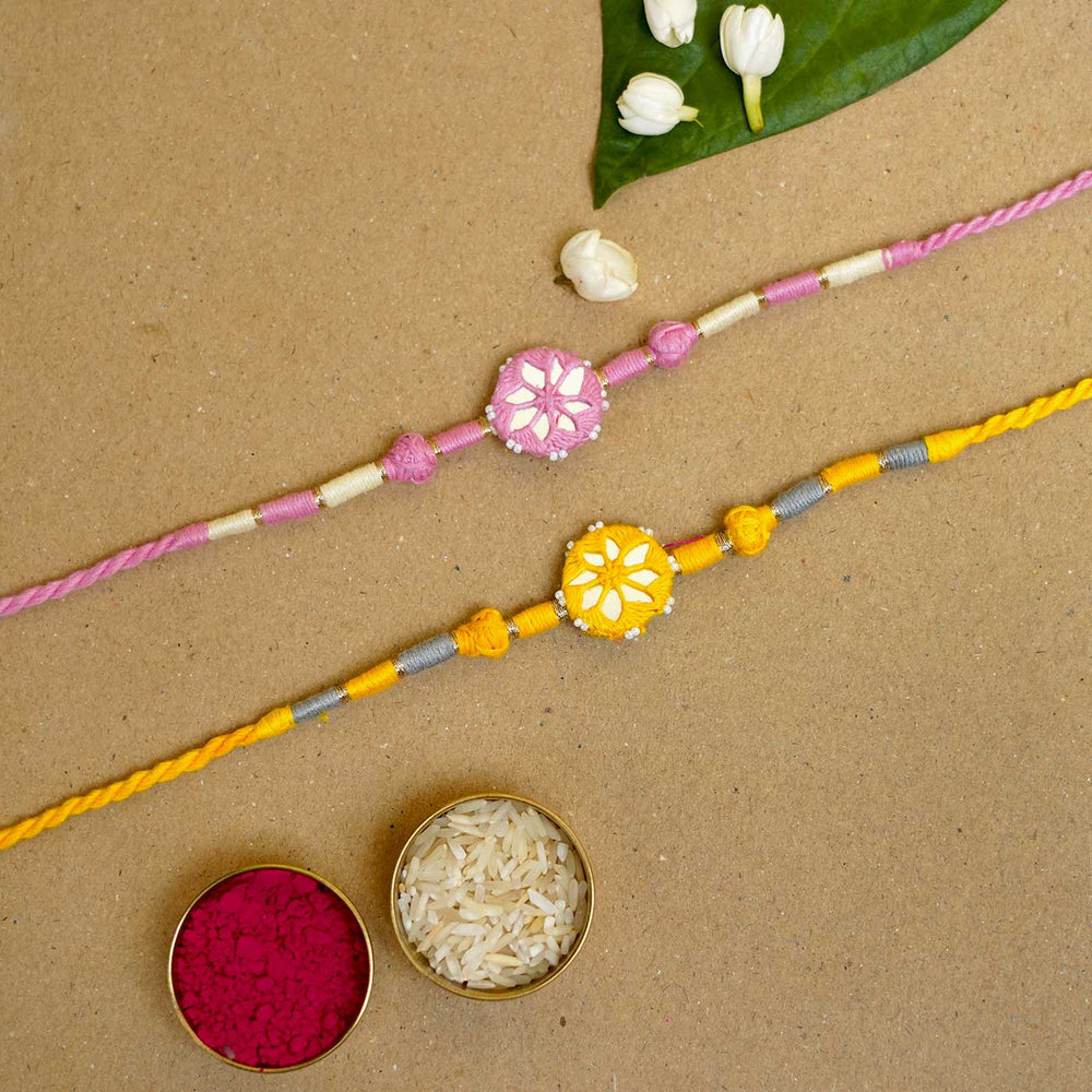 Handmade Mirror Work Patwa Pink Yellow Cotton Rakhi With Roli Chawal Set Of 2 - Bracelets with rice and kumkum