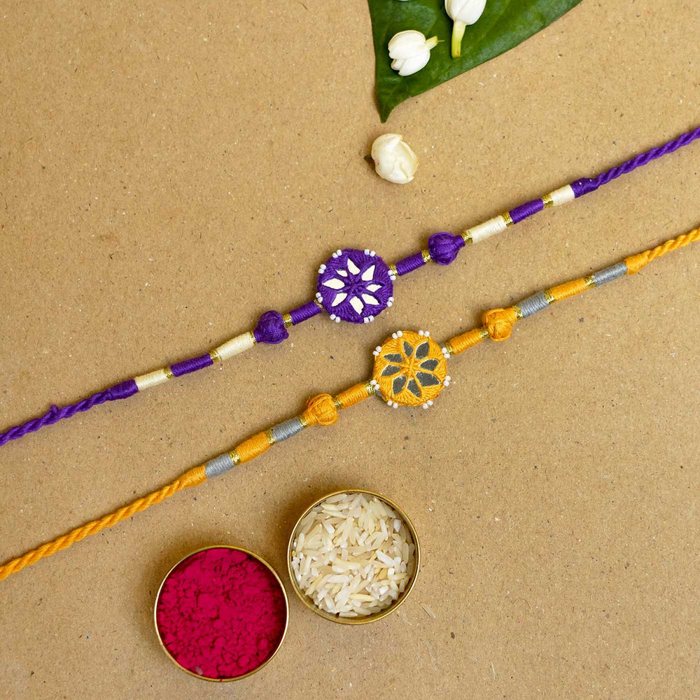 Handmade Mirror Work Patwa Purple Yellow Cotton Rakhi With Roli Chawal Set Of 2 - Rakhis with Raksha Bandhan Essentials