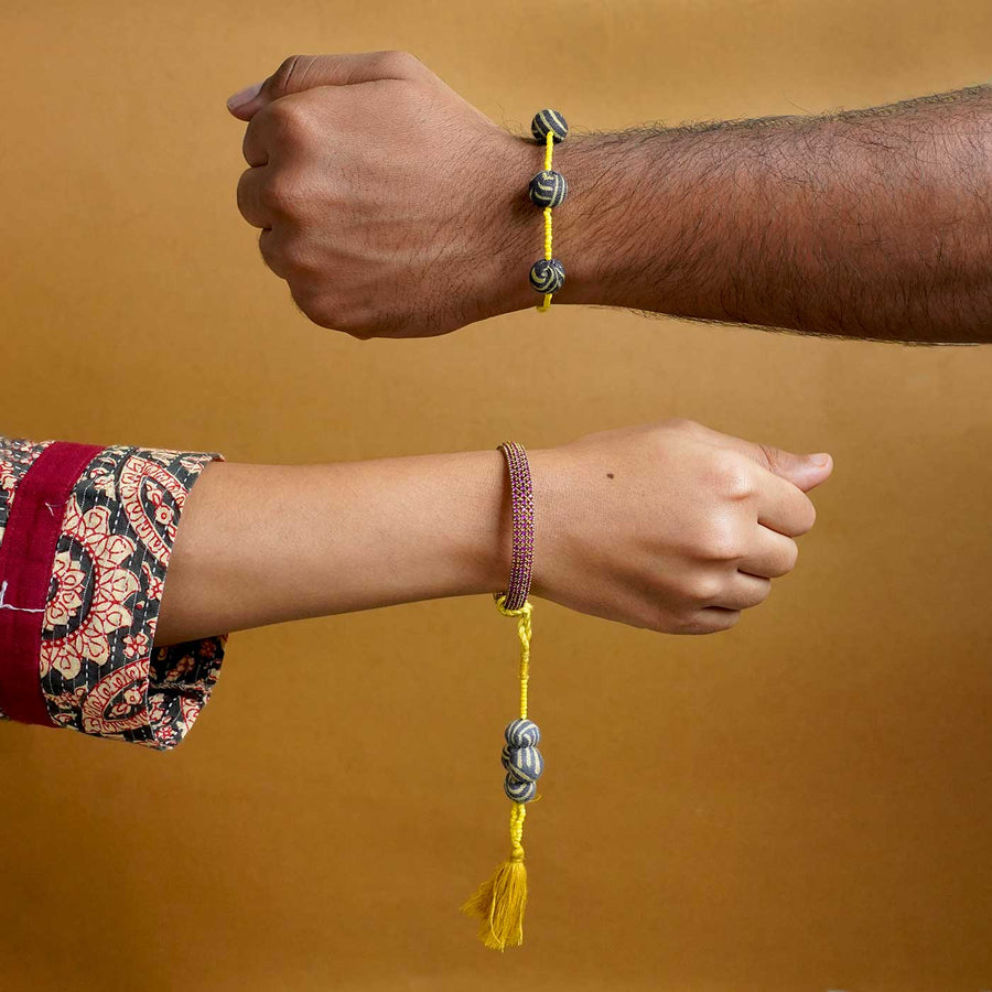 Handmade Swarnamukhi Potli Upcycled Fabric Bhaiya Bhabhi Rakhi With Roli Chawal Set Of 2 - Worn on Wrists Example