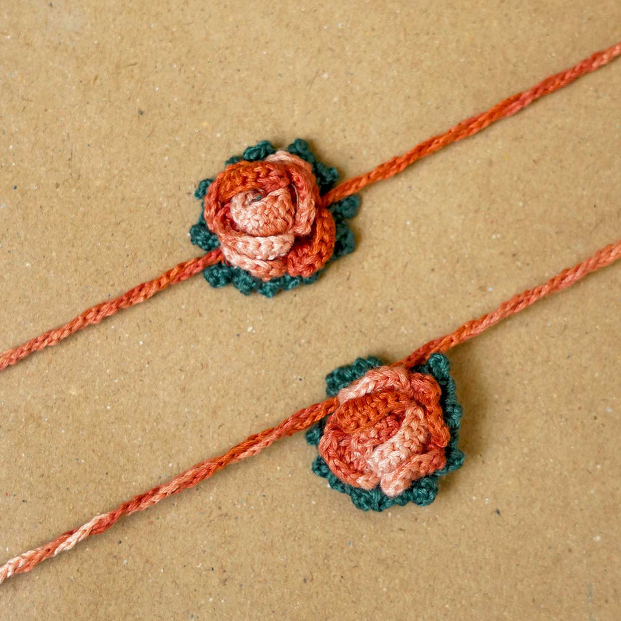 Handmade Crochet Rosette Bhaiya Bhabhi Rakhi With Roli Chawal Set Of 2 - Close-up of Threaded Flower Detail