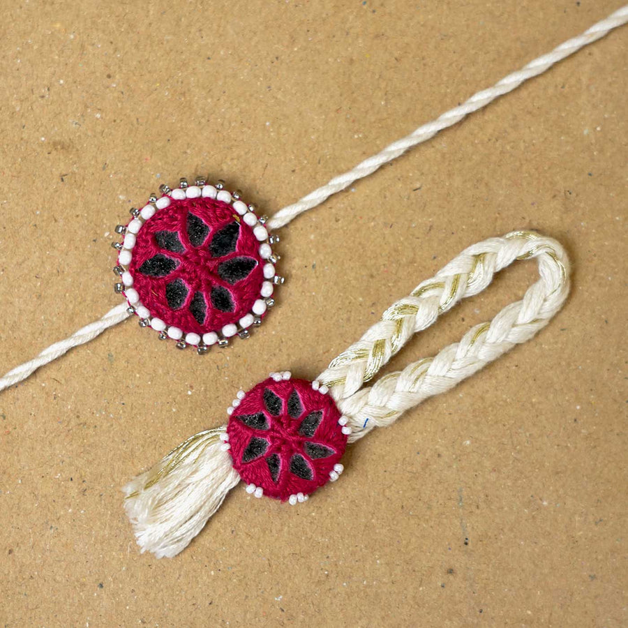 Handmade Mirror Work Kajal Maroon White Bhaiya Bhabhi Rakhi With Roli Chawal Set Of 2 - Close-up of Rakhi Pair