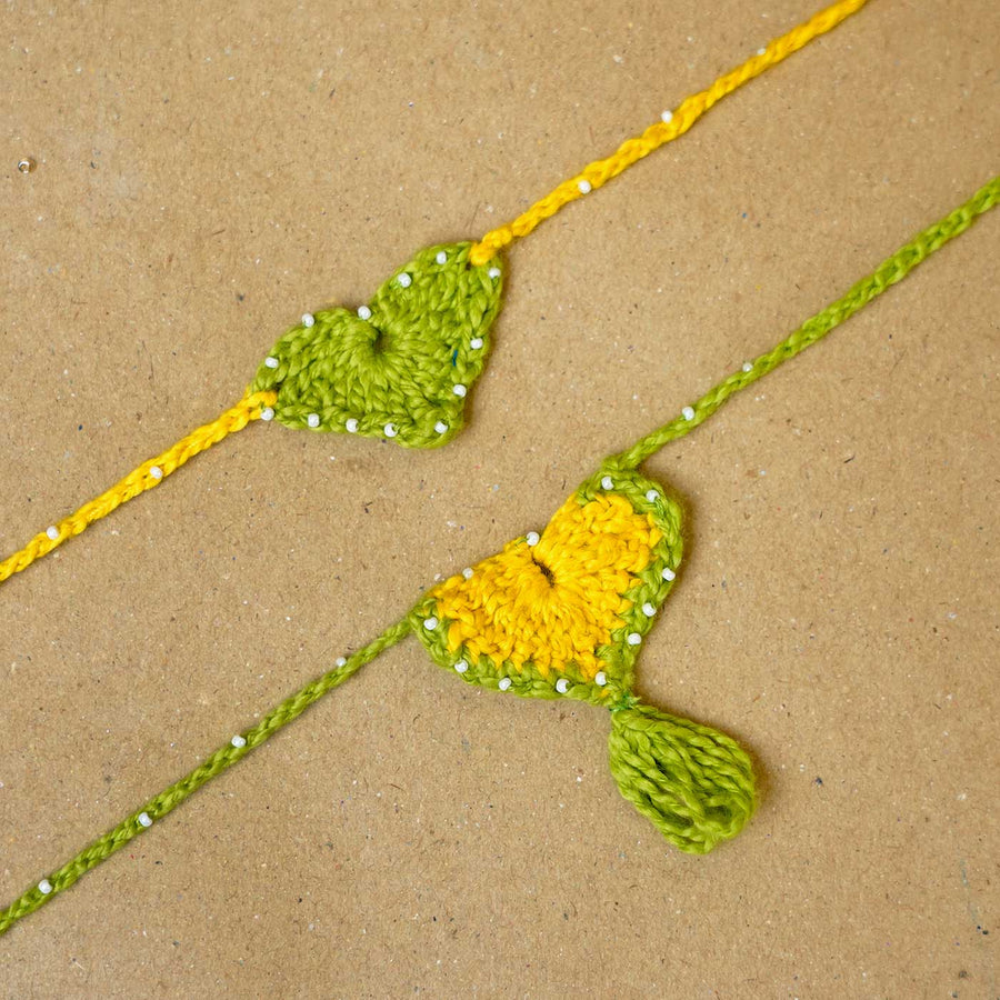 Handmade Crochet Heartfelt Ties Bhaiya Bhabhi Rakhi With Roli Chawal Set Of 2 - Close-up of crochet wristbands