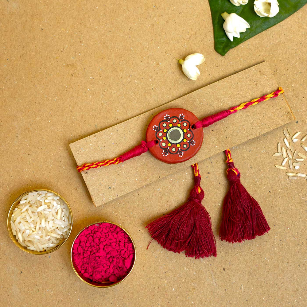 Hand Painted Dharti Terracotta Rakhi With Roli Chawal - Rakhi on card with traditional items