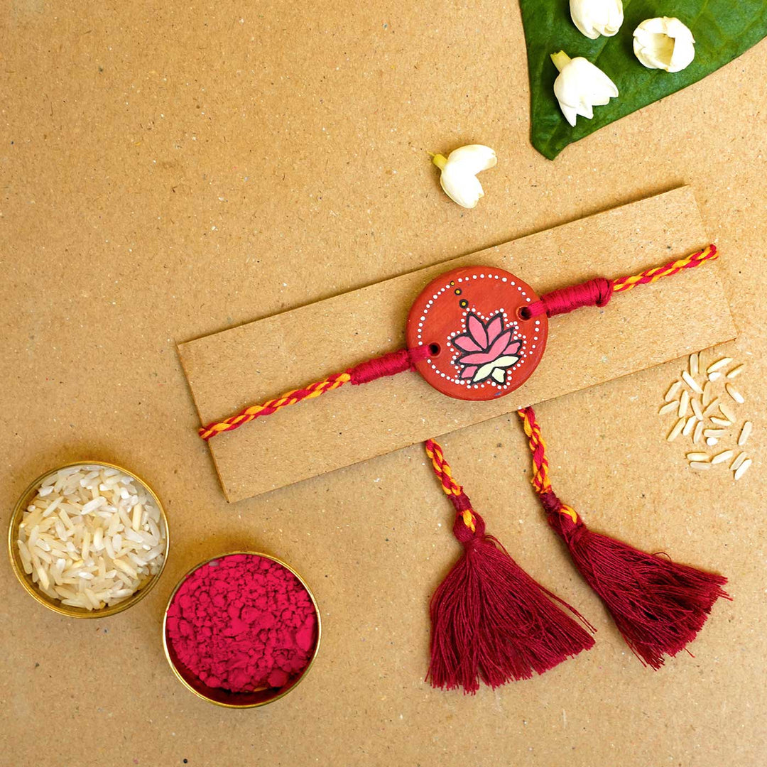 Hand Painted Kamal Terracotta Rakhi With Roli Chawal - Bracelet on card with accessories