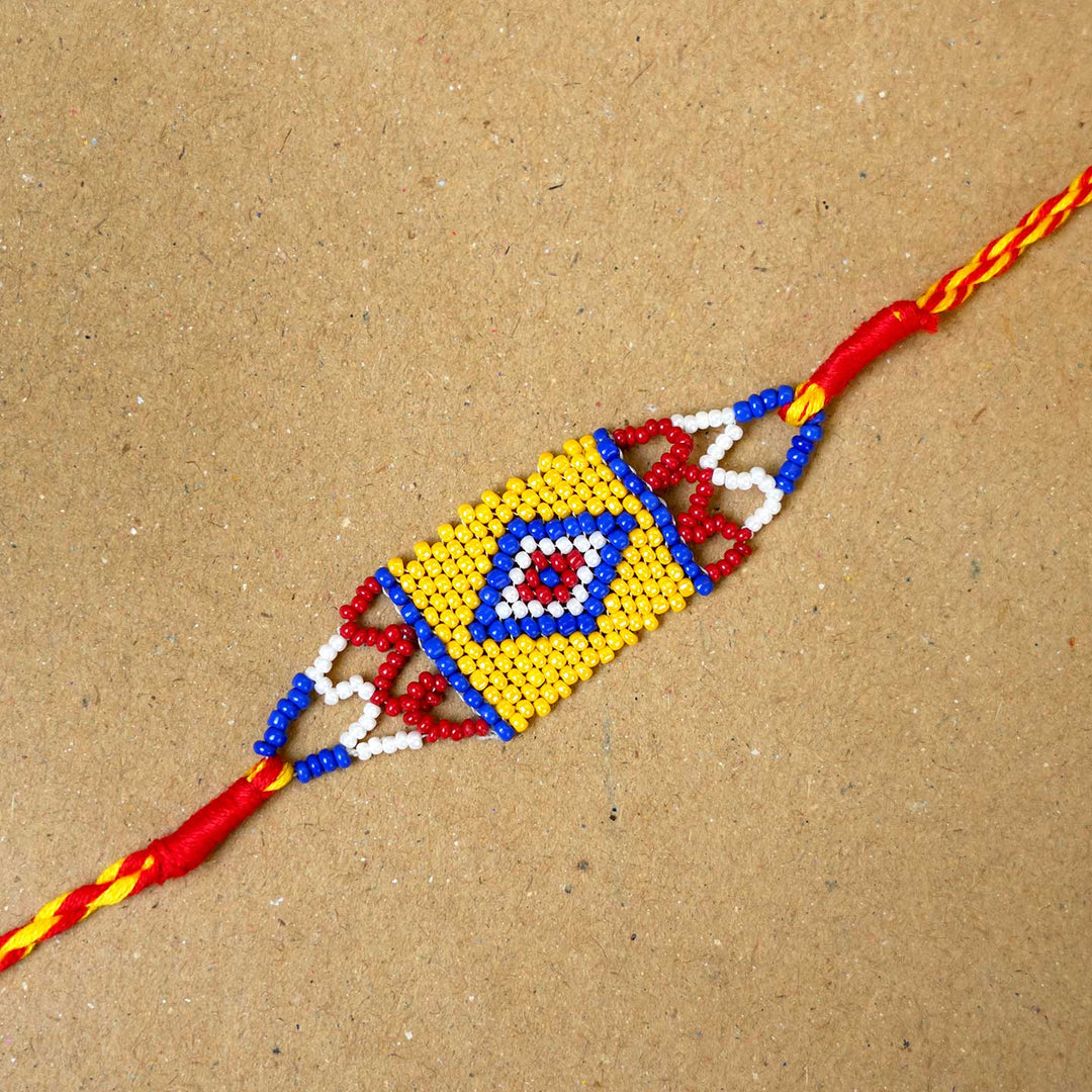 Handmade Beaded Heritage Rakhi With Roli Chawal - Close-up of single Rakhi