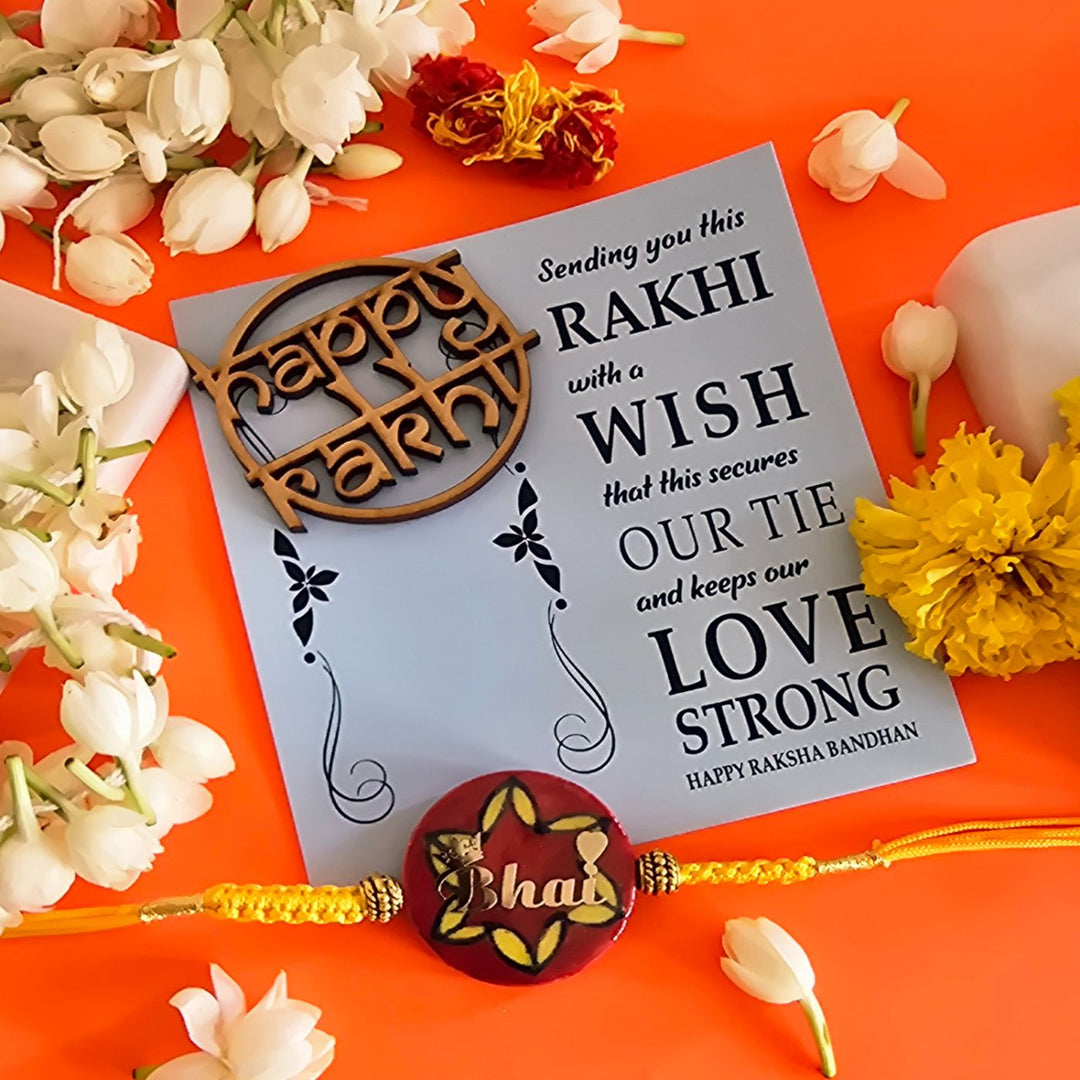 Handmade Laser Cut Red Bhai Ceramic Rakhi With Roli Chawal For Brother - Rakhi and Greeting Card Flat Lay