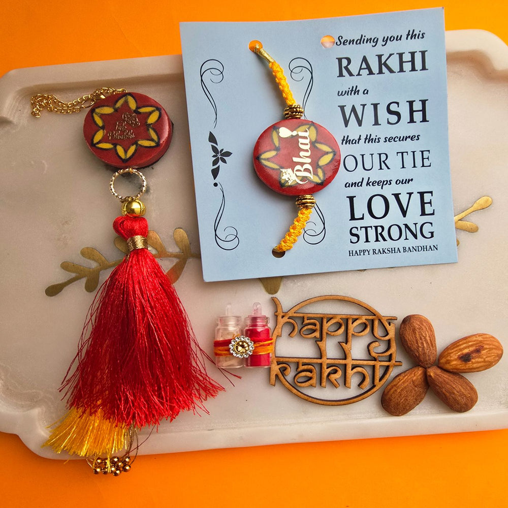Handmade Laser Cut Red Bhai And Fab Bhabhi Ceramic Bhaiya Bhabhi Rakhi With Roli Chawal - Close-up of Rakhi with Wish Card