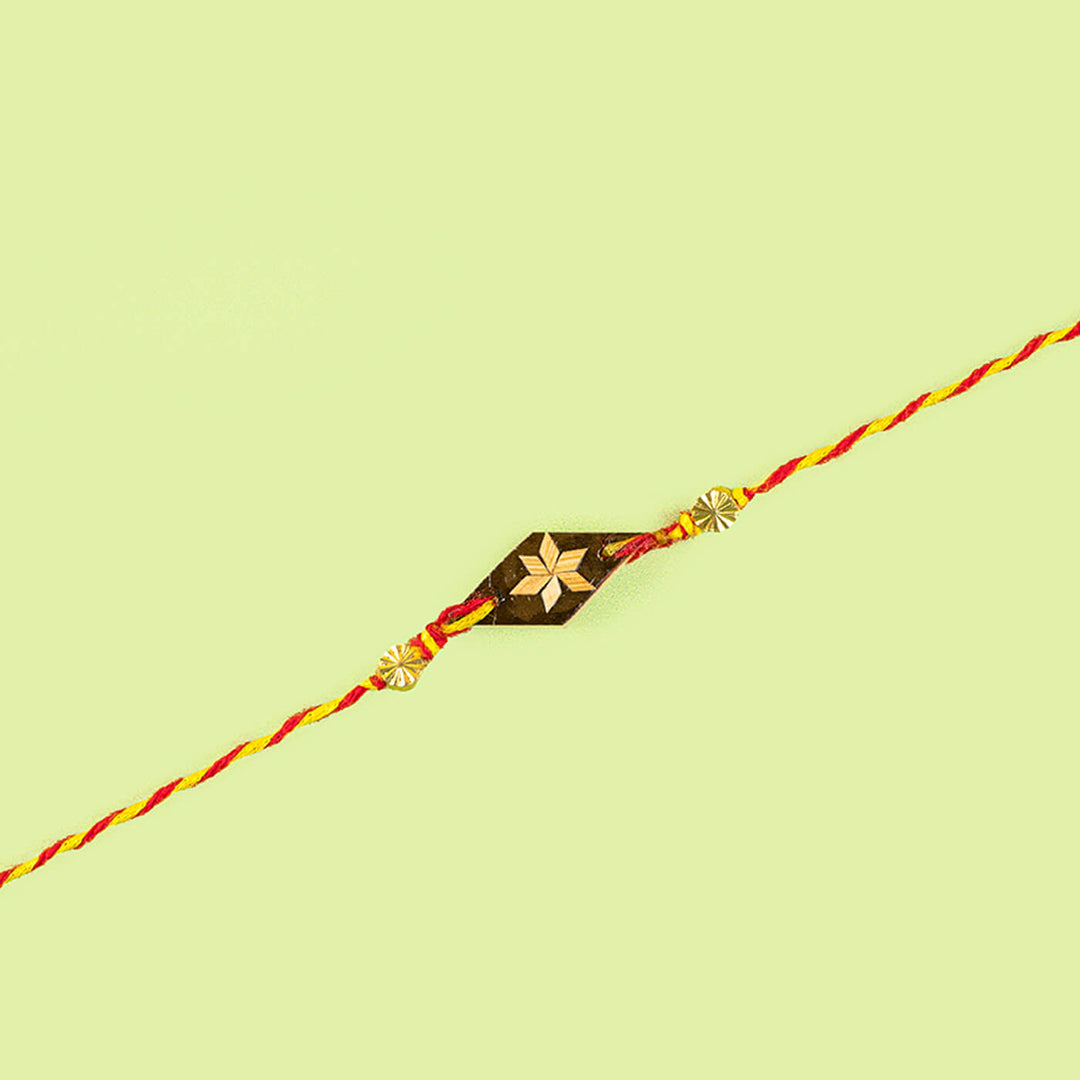 Ecofriendly Two Square Beads Bamboo Rakhi With Roli Chawal - Close-up of floral bead bracelet