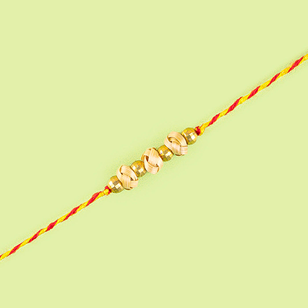 Ecofriendly Two Square Beads Bamboo Rakhi With Roli Chawal - Close-up of spiral bead bracelet