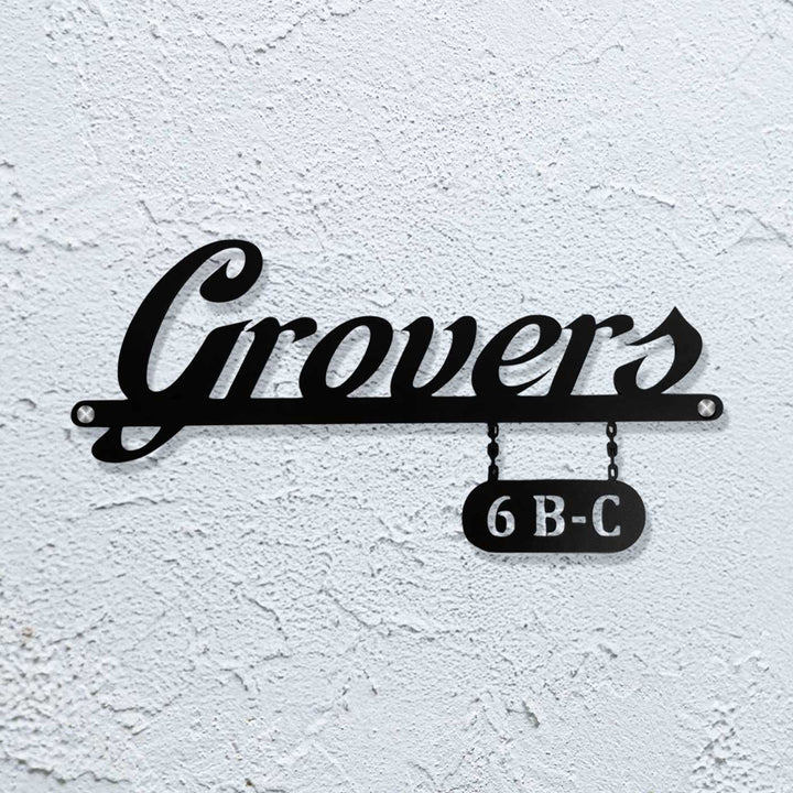 Personalized Waterproof Sleek Black Metal Name Plate - Mounted on White Textured Wall