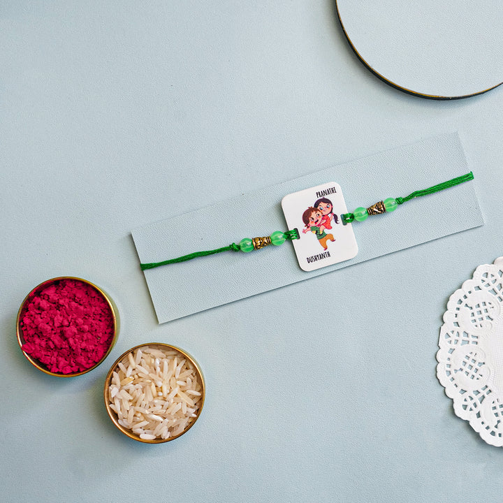Personalized Handmade Printed Bro And Sis Acrylic Rakhi With Roli Chawal - Flat Lay with Ritual Items (4)