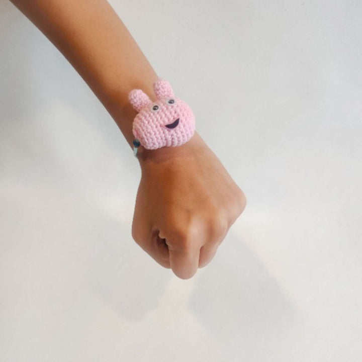 Handmade Crochet Peppa Pig Kids Rakhi With Roli Chawal - On Wrist View