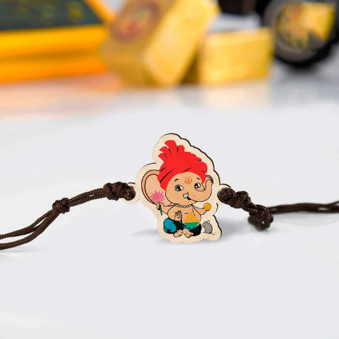 Handmade Ganapati Wooden Kids Rakhi With Roli Chawal - Close-up of Rakhi charm