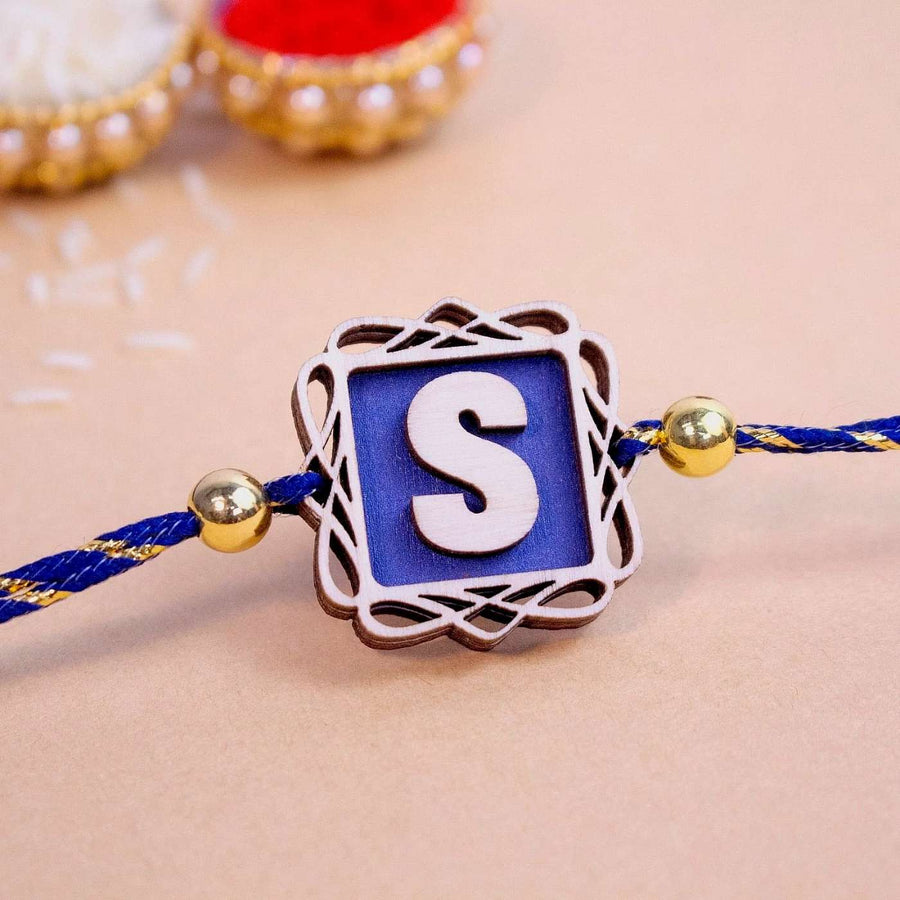 Personalized Handmade Name Initials Wooden Rakhi With Roli Chawal - Close-up of Rakhi centerpiece