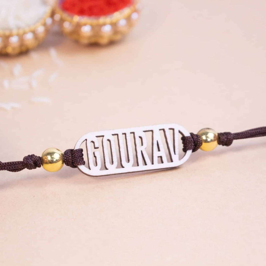 Personalized Handmade Classic Wooden Rakhi With Roli Chawal - Close-up of personalized wooden rakhi