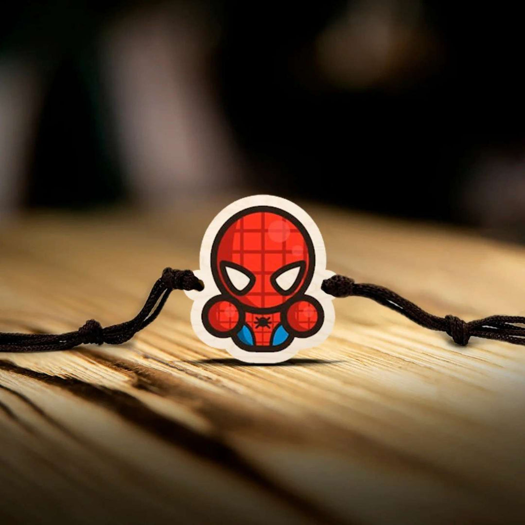 Handmade Spiderman Chibi Wooden Kids Rakhi With Roli Chawal - Close-up on Wooden Surface
