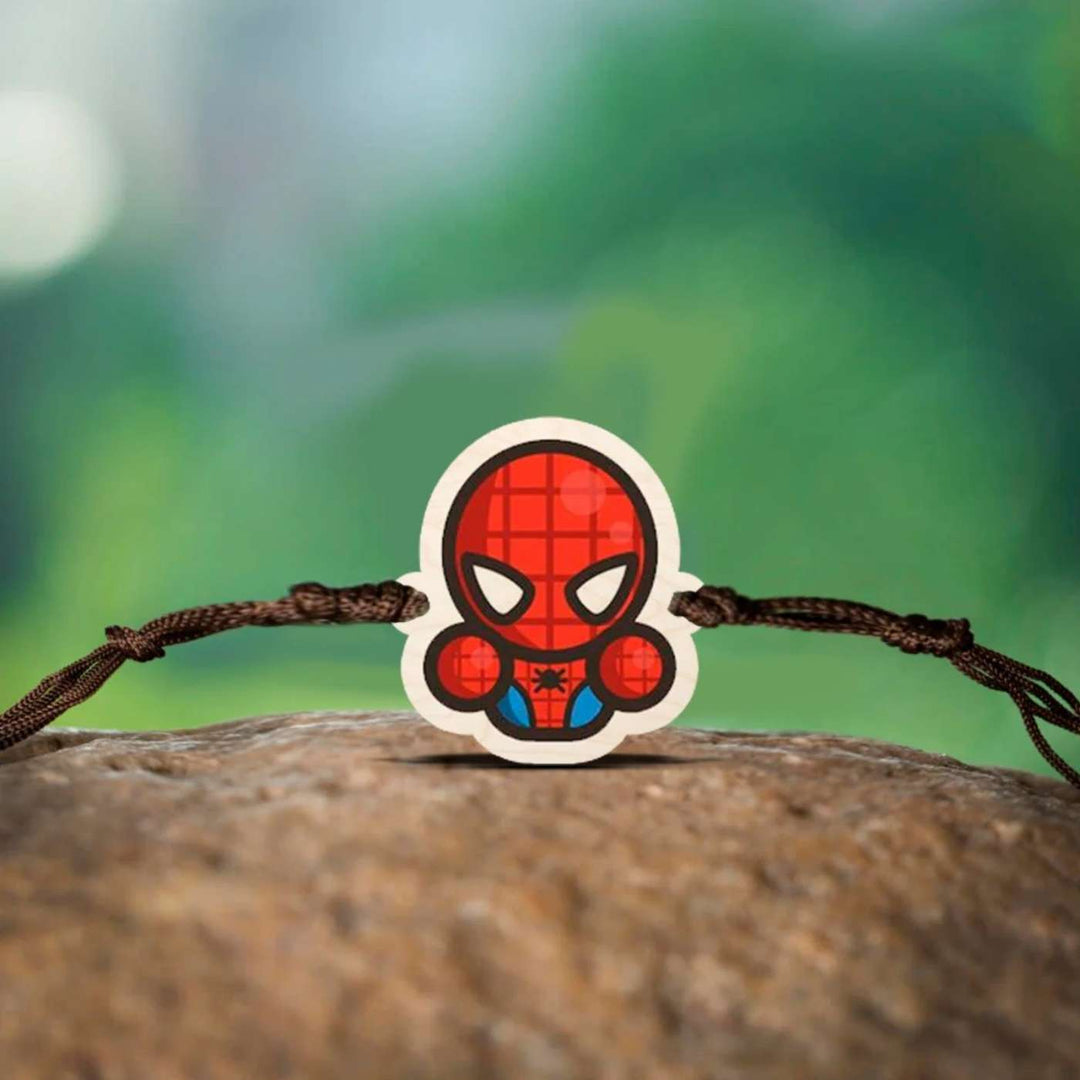 Handmade Spiderman Chibi Wooden Kids Rakhi With Roli Chawal - Displayed on Natural Surface