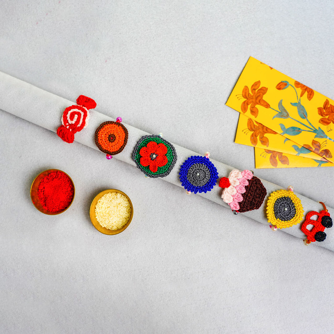 Quirky Handcrafted Crochet Rakhi With Roli Chawal For Kids 2 - Set Display with Ritual Items