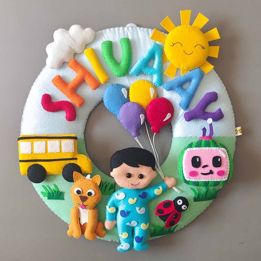 Hand Stitched Cocomelon Themed Round Felt Kids Name Plate For Baby Boy - Front View with Name Personalization