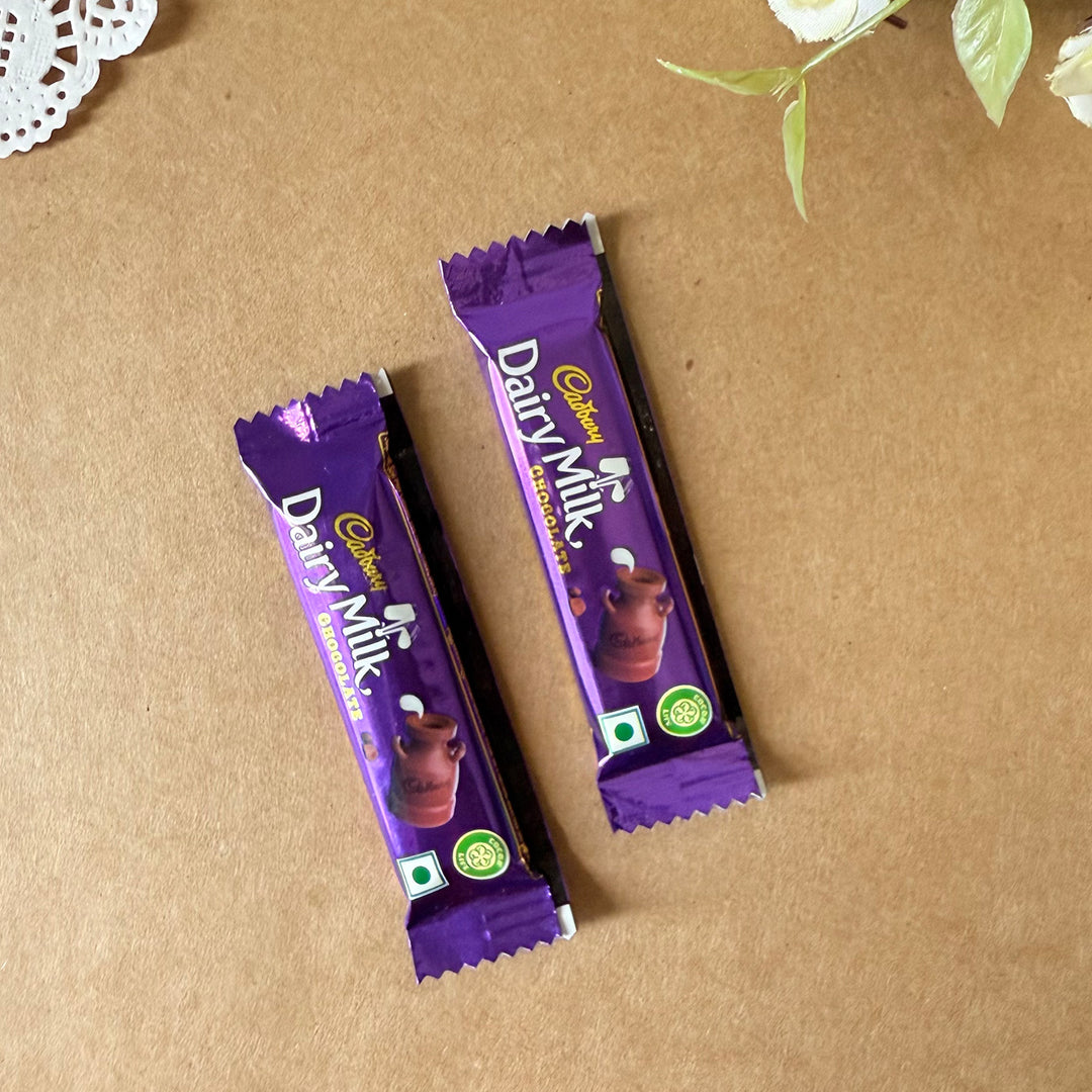 Rakhi Gift Hamper For Brother | Includes 1 Mini Photo Frame, 1 Rakhi, 1 Roli Chawal, 1 Letter And 2 Diary Milk