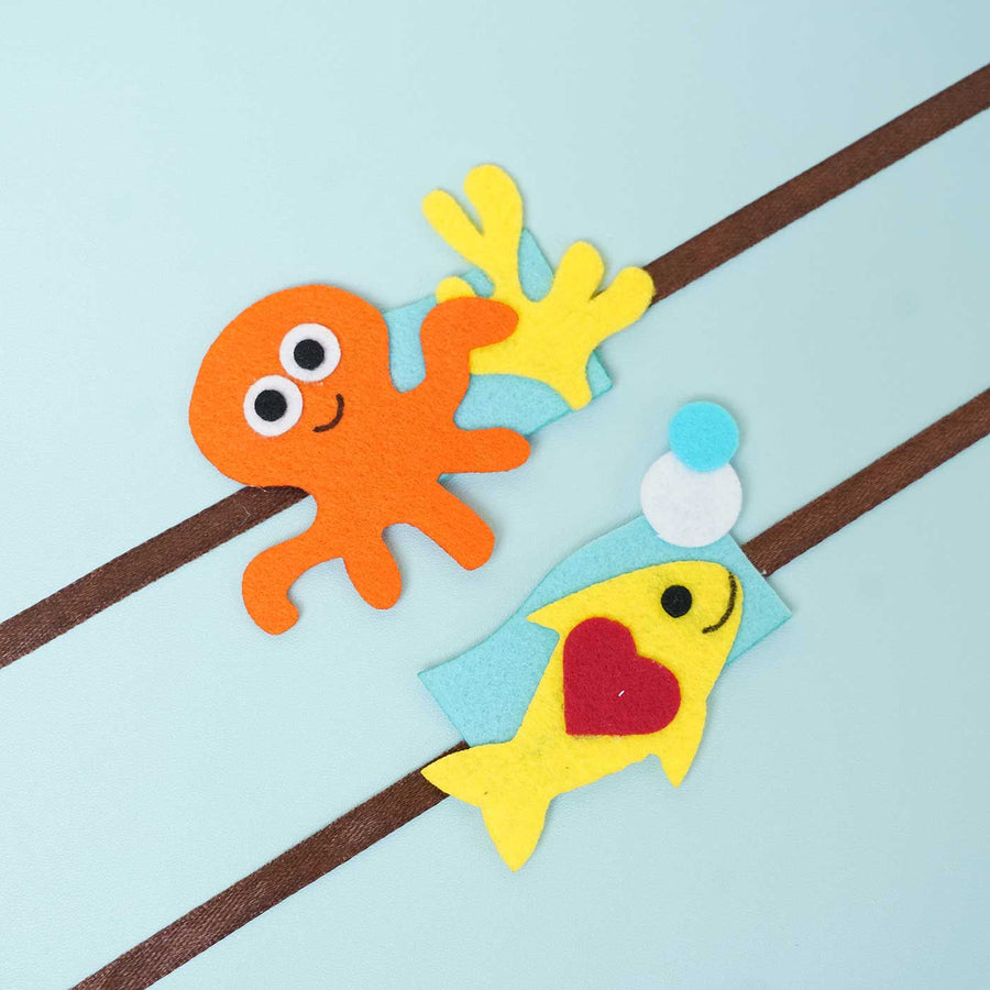 Handmade Underwater Felt Rakhi With Chocolates Roli Chawal I Set Of 2 - Close-up of Felt Decorations