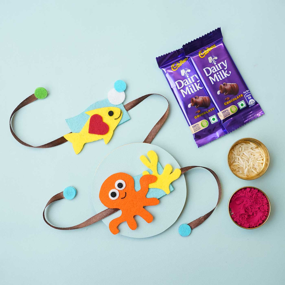 Handmade Underwater Felt Rakhi With Chocolates Roli Chawal I Set Of 2 - Flat Lay with Related Items