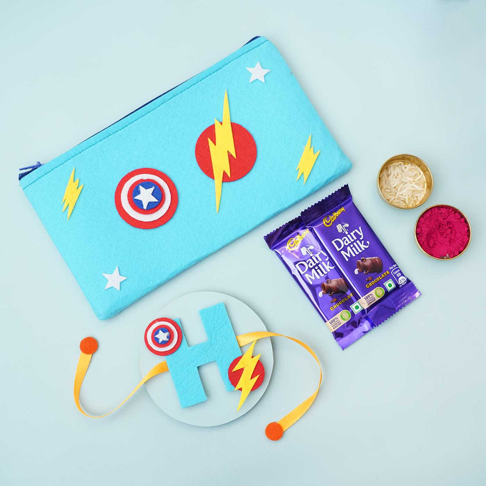 Personalised Handmade Felt Rakhi Superhero Pouch With Chocolates Roli Chawal - Flat Lay with Chocolates and Pooja Items