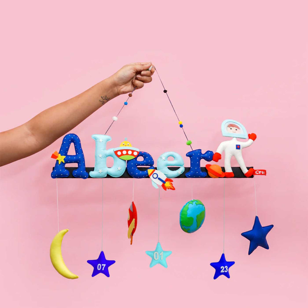 Astronauts Spaceship Name Plate For Kids - Held by Hand Against Background