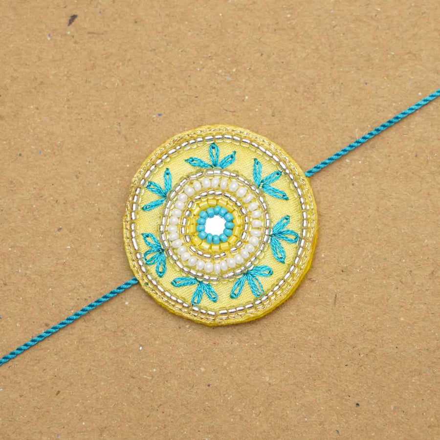 Handmade Beaded Round Rakhi With Roli Chawal - Close-up of single bracelet detail