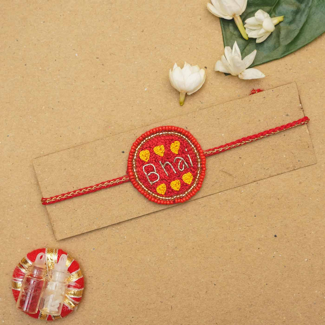 Handmade Beaded Bhai Rakhi With Roli Chawal 1 - Flat lay on card backing