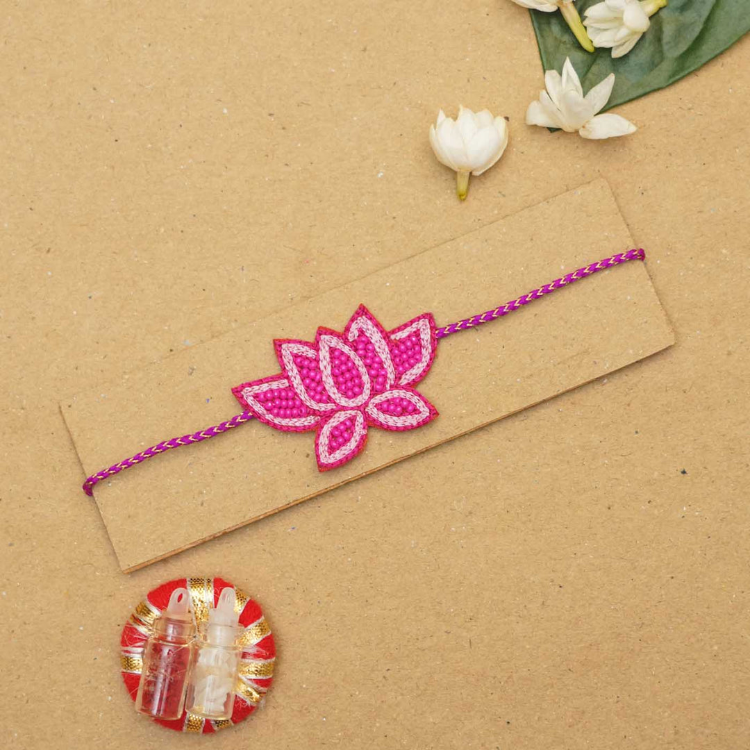 Handmade Beaded Lotus Rakhi With Roli Chawal - Flat Lay Front View