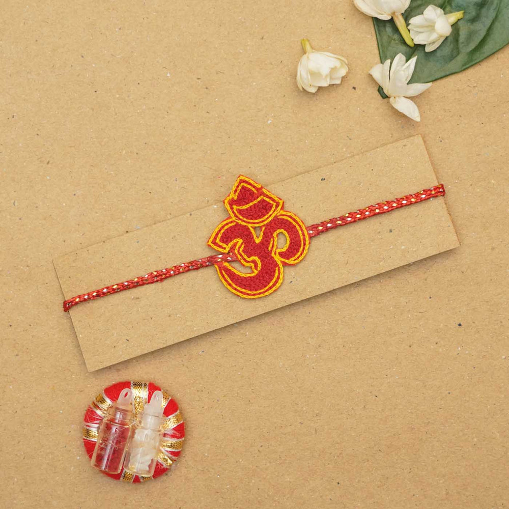 Handmade Beaded Om Rakhi With Roli Chawal - Packaged on card with gifts