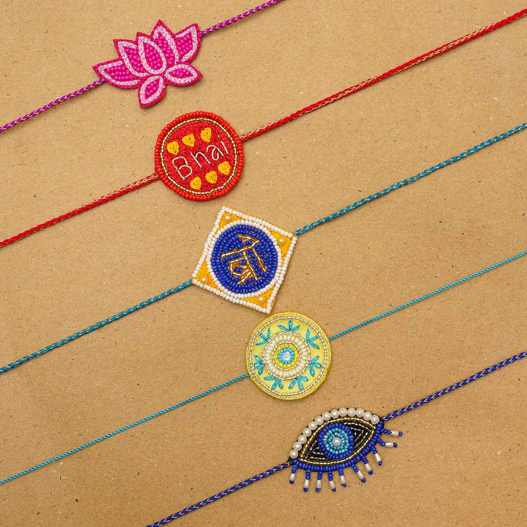 Handmade Beaded Pink Sis Rakhi With Roli Chawal - Group of assorted charms