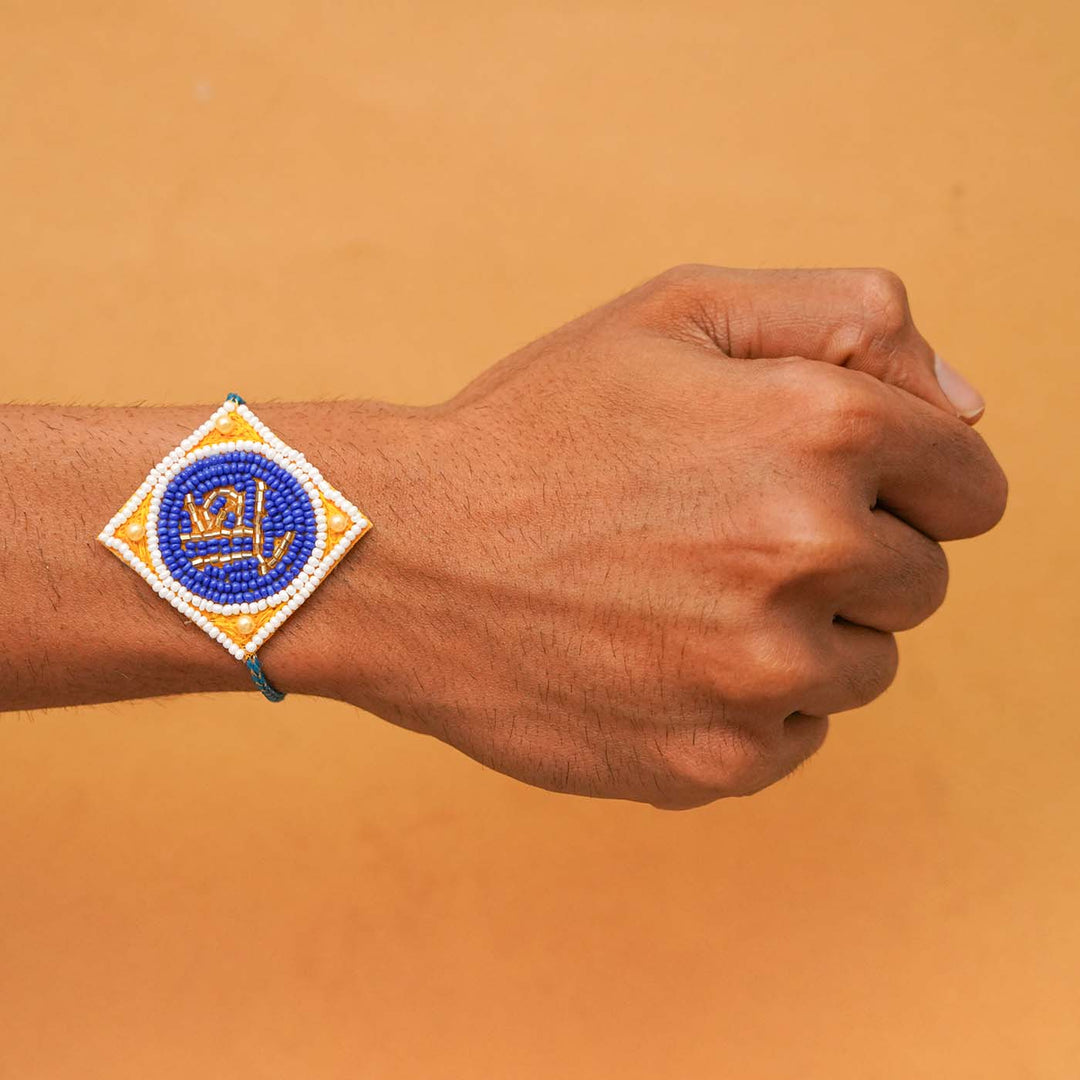 Handmade Beaded Bro Rakhi With Roli Chawal - Worn on Wrist Display