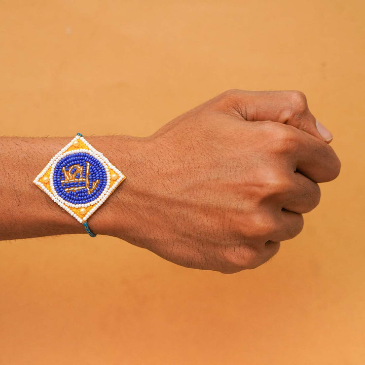Handmade Beaded Bro Rakhi With Roli Chawal - Worn on Wrist Display
