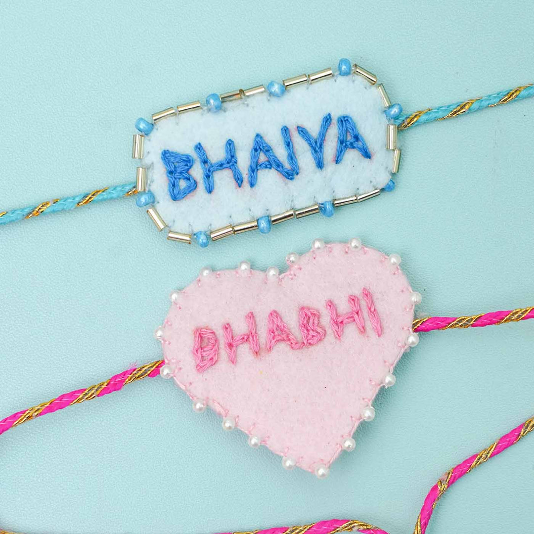 Handmade Felt Bhaiya Bhabhi Rakhi With Roli Chawal Set Of 2 - Close-up of Embroidered Names