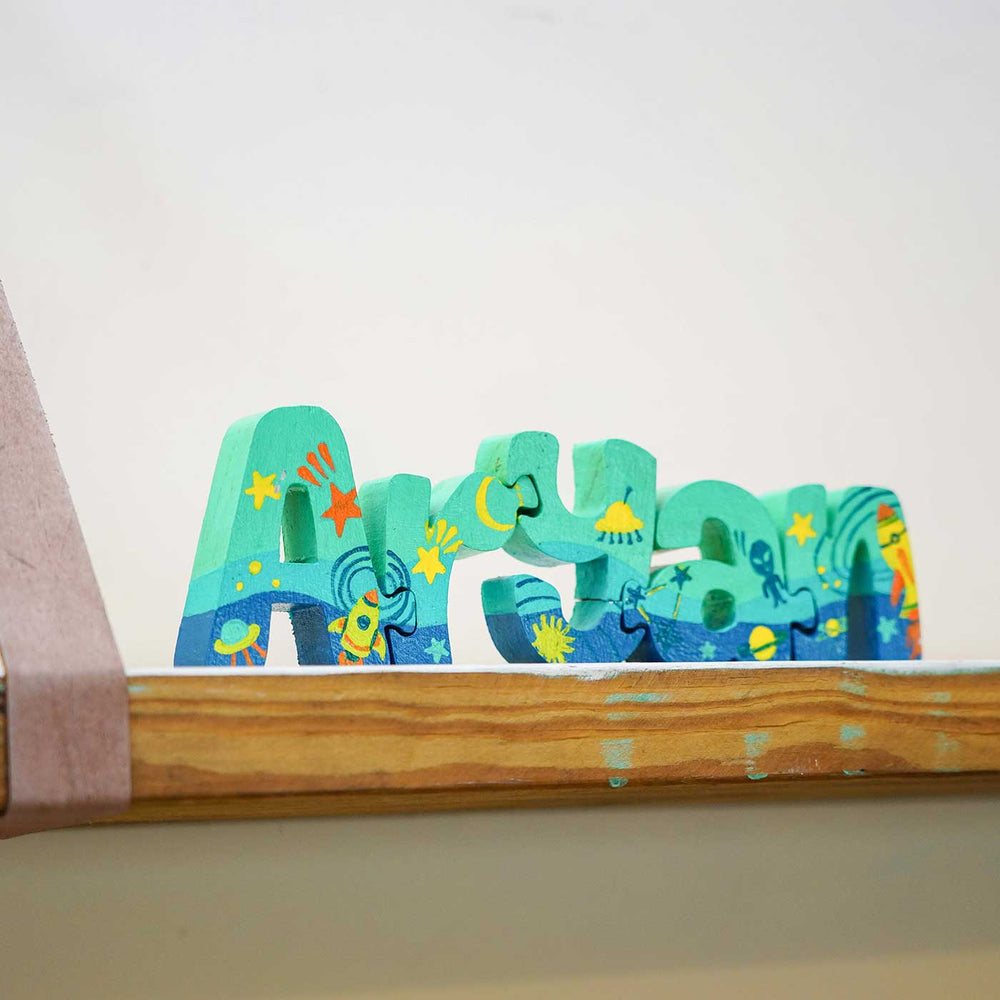 Hand Painted Wooden Jigsaw Name Blocks - Side View on Wooden Shelf