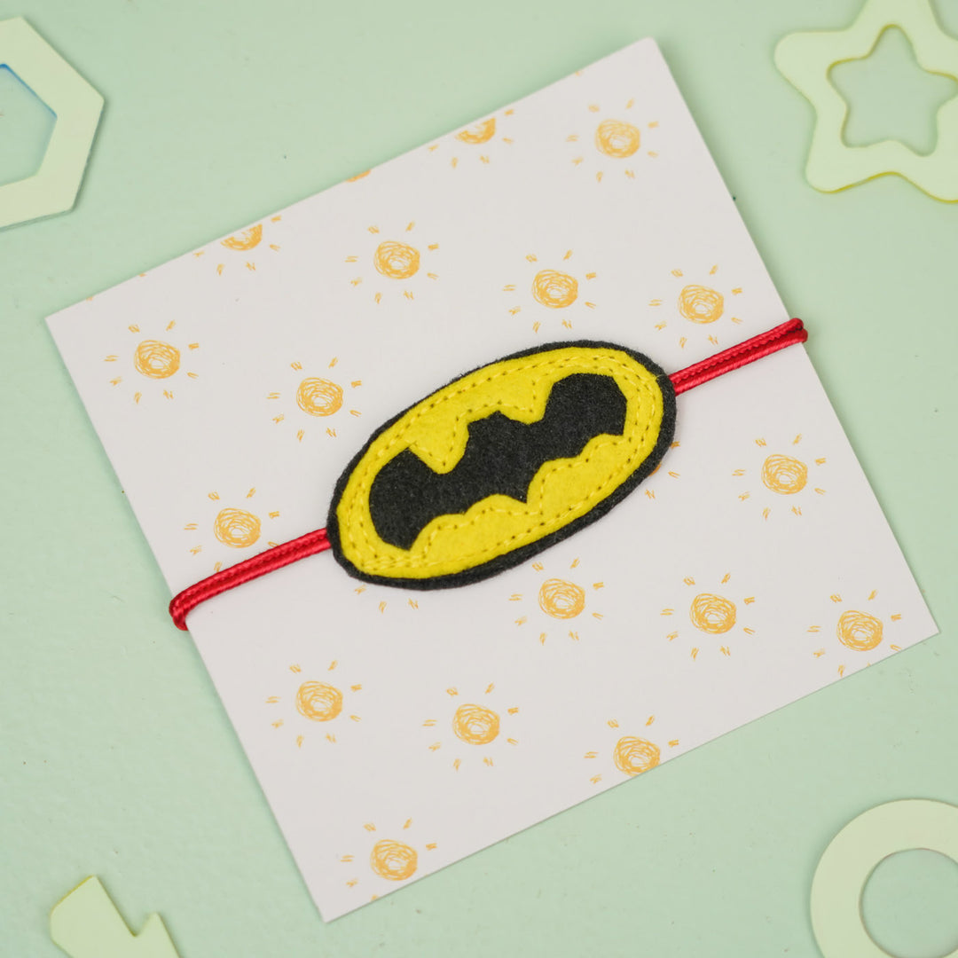 Handmade Batman Theme Felt Kids Rakhi For Brother - On card from angled view