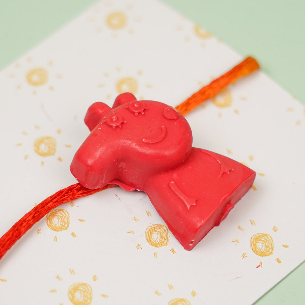 Customized Handmade Peppa Pig Theme Wax Rakhi For Kids - Close-up of Charm Detail