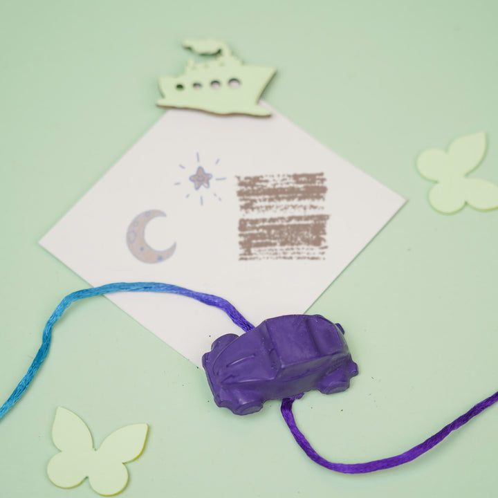 Customized Handmade Vehicles Theme Wax Rakhi For Kids - Styled Flat Lay with Car
