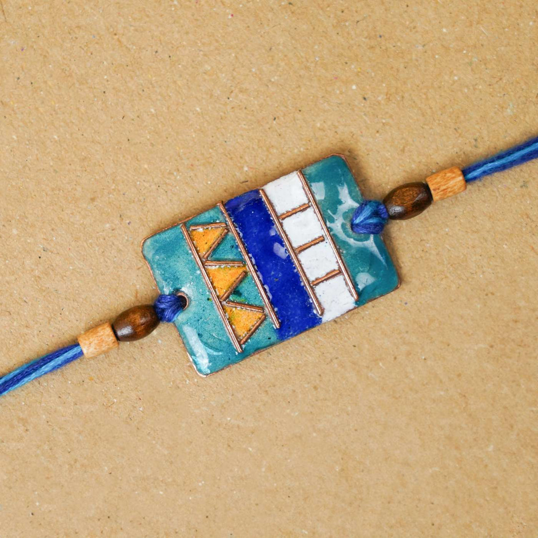 Handmade Zentangle Copper Enamel Rakhi With Chocolates And Roli Chawal - Close-up of Geometric Design Bracelet
