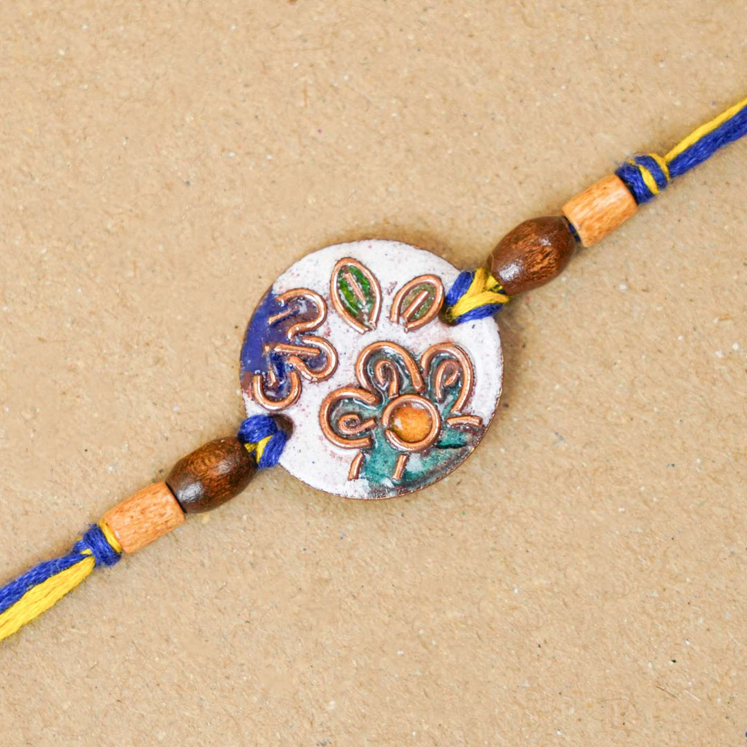 Handmade Phool White Copper Enamel Rakhi With Chocolates And Roli Chawal - Close-up of Rakhi thread detail