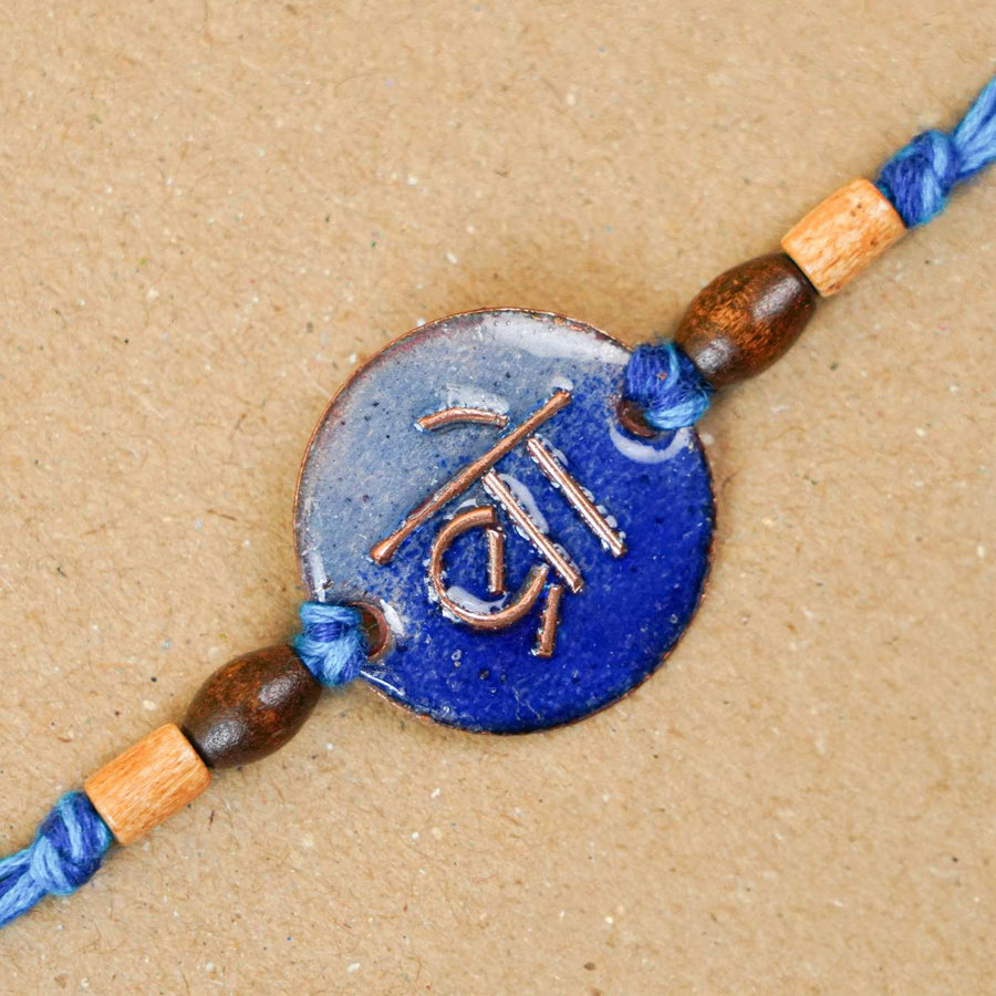 Handmade Bro Blue Copper Enamel Rakhi With Chocolates And Roli Chawal - Close-up of Rakhi detail