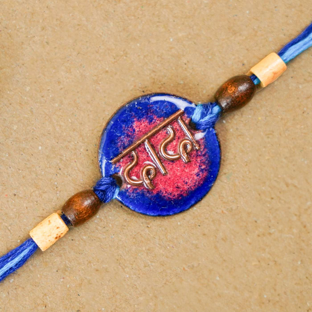 Handmade Dada Blue Copper Enamel Rakhi With Chocolates And Roli Chawal - Close-up of Rakhi bead detail