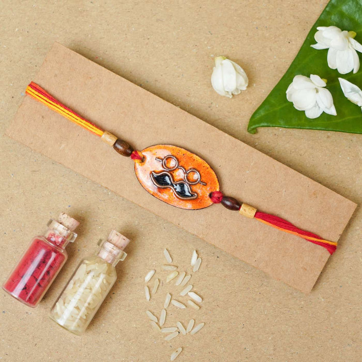 Handmade Mooch Copper Enamel Rakhi With Chocolates And Roli Chawal - Rakhi Display on Cardboard Base
