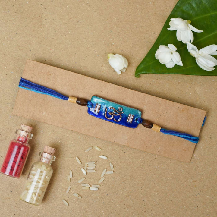 Handmade Rectangle Om Copper Enamel Rakhi With Chocolates And Roli Chawal - Mounted on Cardboard Display (6)