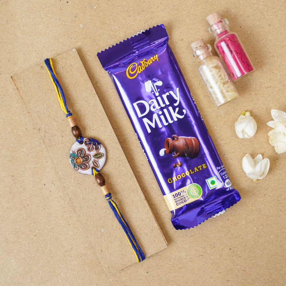 Handmade Phool White Copper Enamel Rakhi With Chocolates And Roli Chawal - Rakhi with chocolate and decorative items