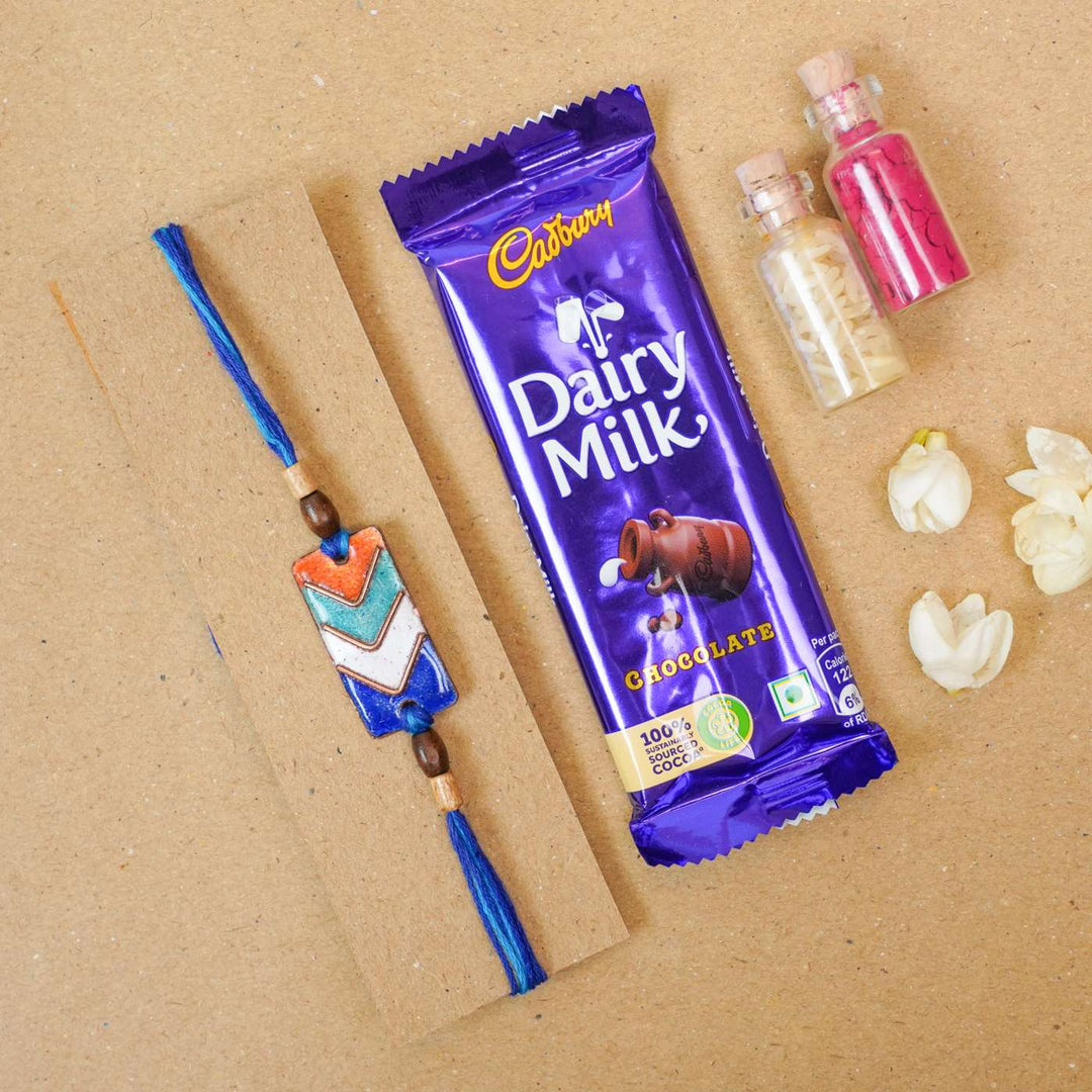 Handmade Arrows Copper Enamel Rakhi With Chocolates And Roli Chawal - Bracelet with Chocolate Gift Set