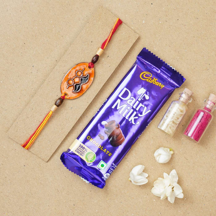 Handmade Mooch Copper Enamel Rakhi With Chocolates And Roli Chawal - Rakhi with Packaging and Chocolate